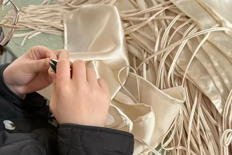 Final quality inspection of custom silk products before packaging