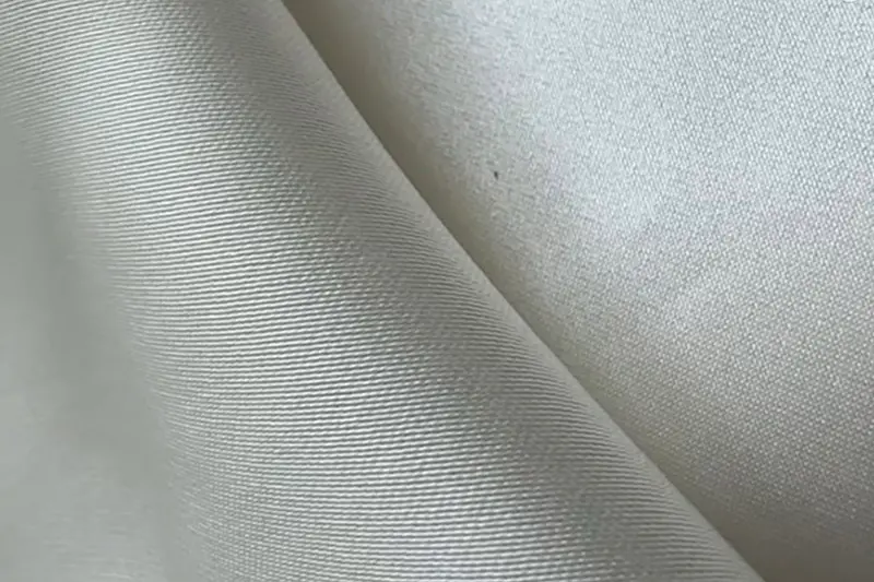 Silk satin and polyester satin fabric swatches side by side