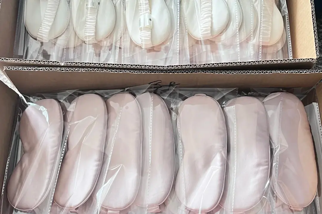 Boxed silk sleep masks.