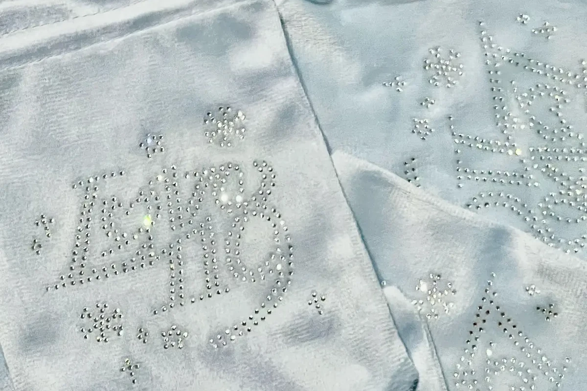 Rhinestone decorations on light blue silk pouches