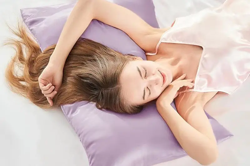 Silk pillowcase helping reduce hair frizz and breakage during sleep