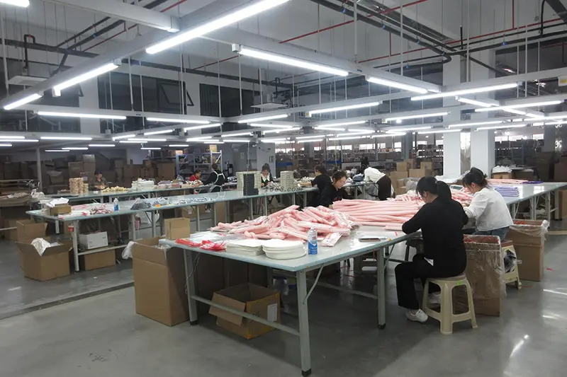 workers packaging custom silk shawls