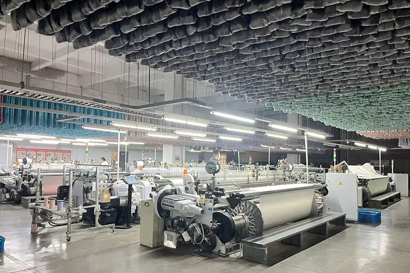 Workers crafting premium silk fabrics and products