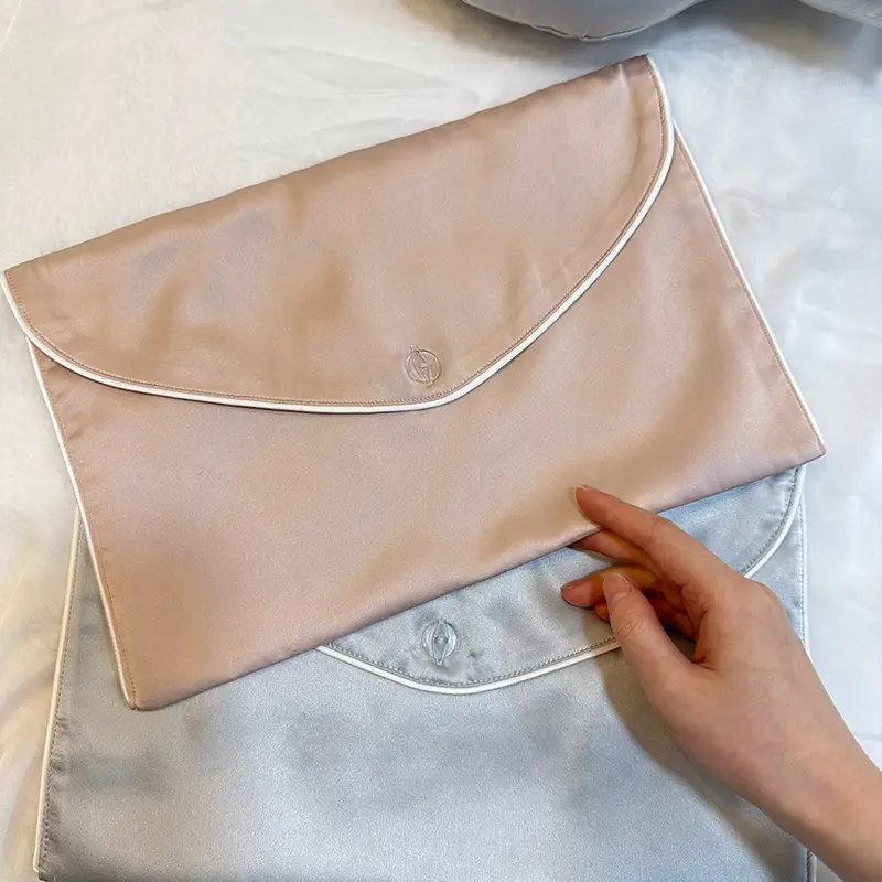 Pink and silver silk envelope bags for hair extension packaging