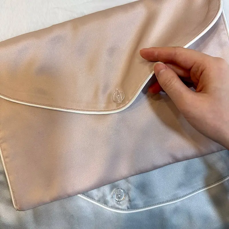 Close-up of silk hair extension envelope bag logo placement