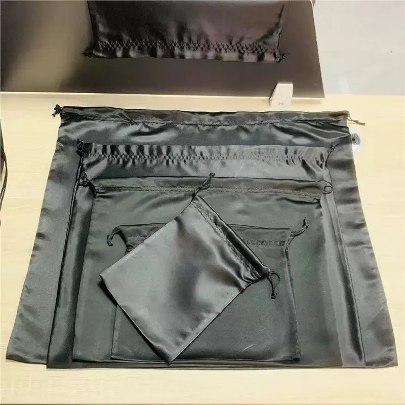 Black satin handbag dust bags in graduated sizes