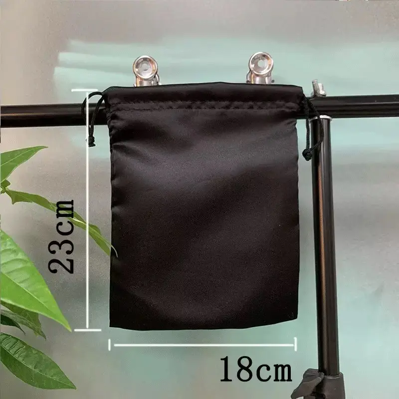 Black satin handbag dust bag measuring 18 by 23 centimeters