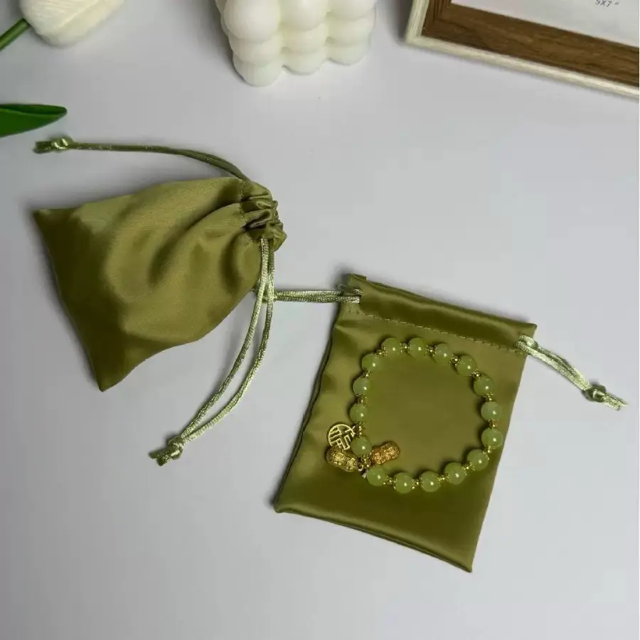 Olive green satin drawstring jewelry pouches with bracelet styling