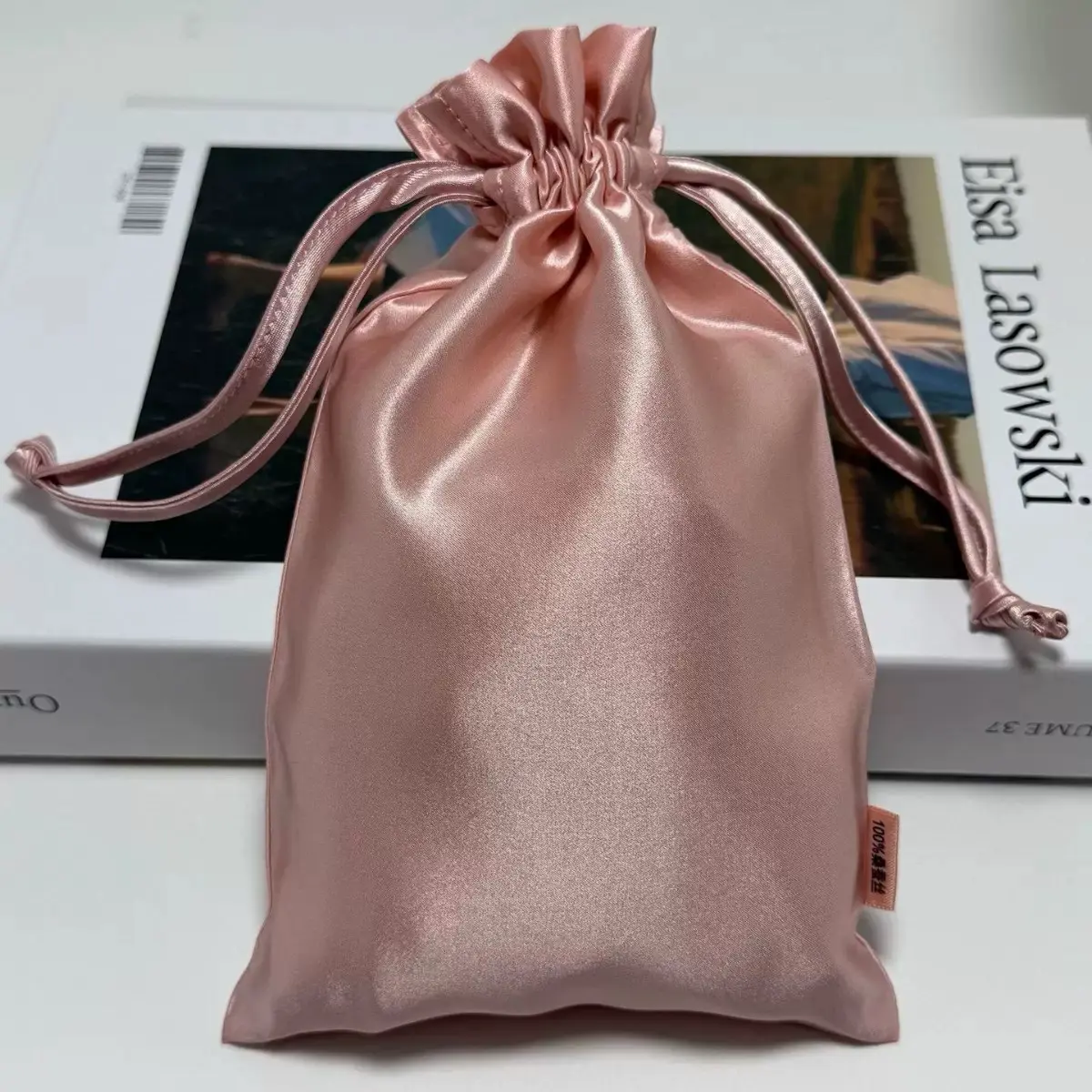 Blush pink satin favor pouch with gathered drawstring