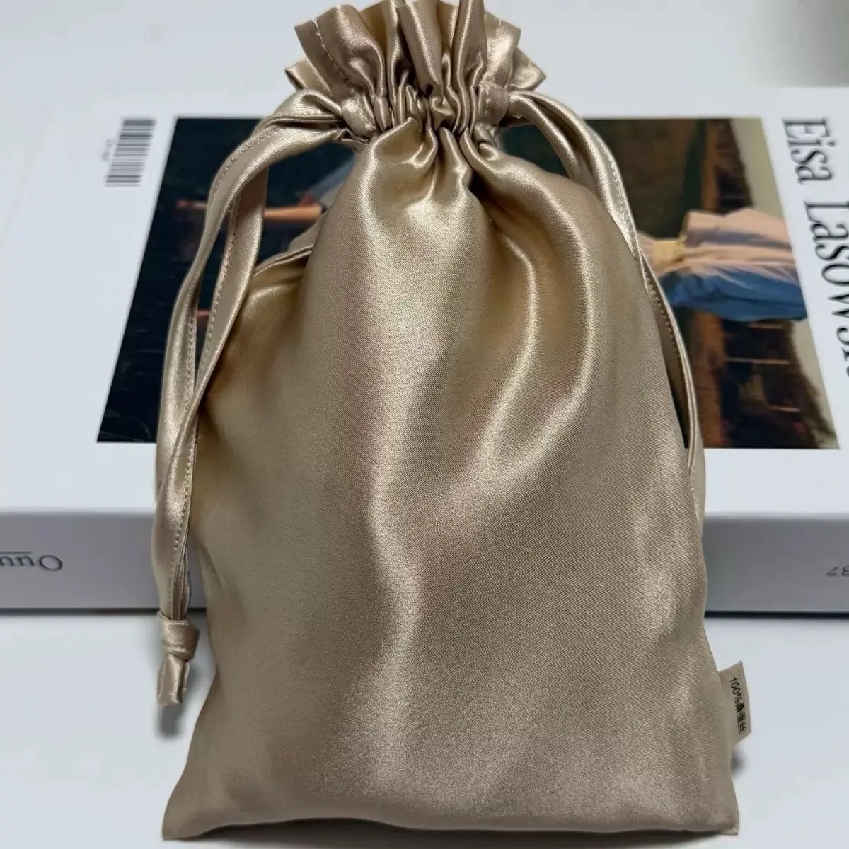 Champagne satin favor pouch with ruffled top
