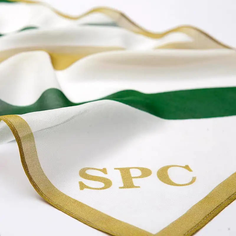 Close-up of logo detail on promotional silk scarf