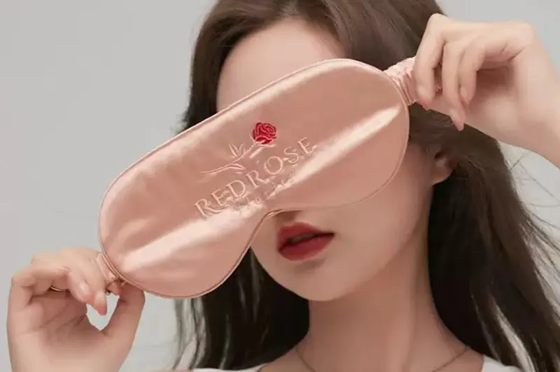 Embroidered logo applications on silk scarves sleepwear and pillowcases